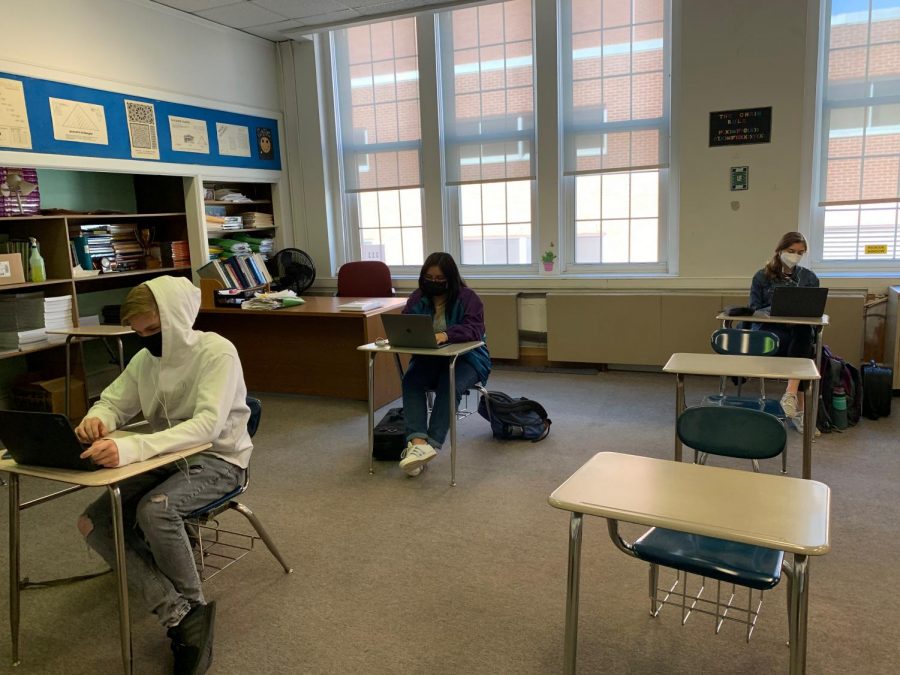 Students (Michael Mahoney, Katherine Mora,  Zoë Rose) in Mr. Tullos calculus class learn virtually, despite being present in school.