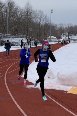 Senior Zoë Rose competing in the 1000m race at an “Indoor” Track meet this winter