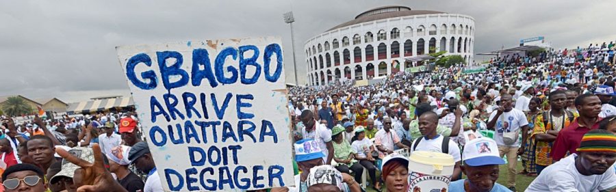 A protest sign that roughly translates to Gbagbo needs to come, Ouattara should leave.