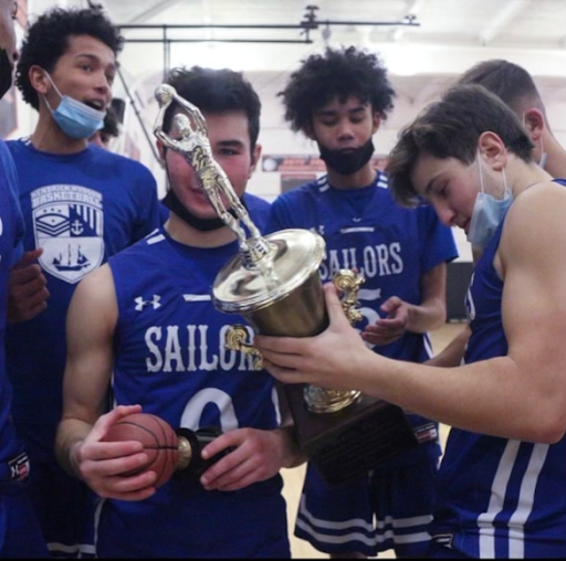 Last years Boys Varsity Basketball team holding the Gazette Cup after beating Croton in an ongoing traditional game. Courtesy of the Hud Hud Student Governments Instagram.