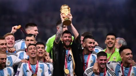 Argentina’s captain and forward #10 Lionel Messi (C) lifts the FIFA World Cup Trophy on stage as he celebrates with teammates after they won the Qatar 2022 World Cup final football match between Argentina and France at Lusail Stadium in Lusail, north of Doha on December 18, 2022. 
Kirill Kudryavtsev | Afp | Getty Images
